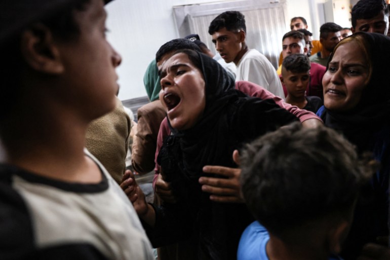 A Palestinian woman who lost members of her family in an Israeli strike reacts upon seeing their bodies at the Nasser hospital in Khan Yunis in the southern Gaza Strip on November 3, 2024.