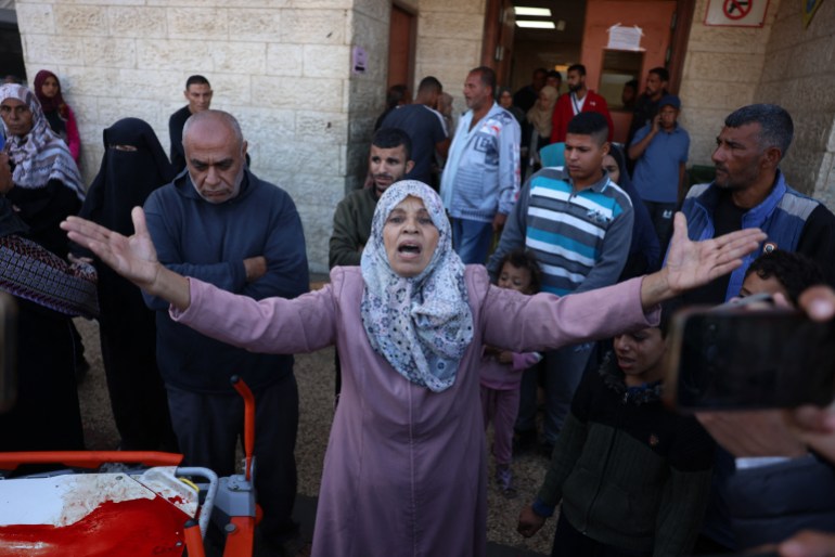 A Palestinian woman reacts as victims of an Israeli strike are transported to the al-Aqsa Martyrs Hospital in Deir Al-Balah in the central Gaza Strip on November 17, 2024, amid the ongoing war between Israel and the Palestinian Hamas militant group. (Photo by BASHAR TALEB / AFP)