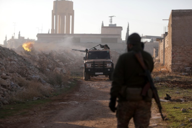 Fighters fire towards Syrian Army troops in the Rashidin district on the outskirts of Aleppo on November 29, 2024