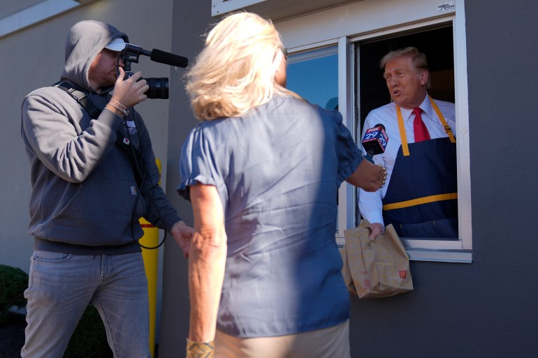 Donald Trump is interviewed through a drive-thru window at McDonald's