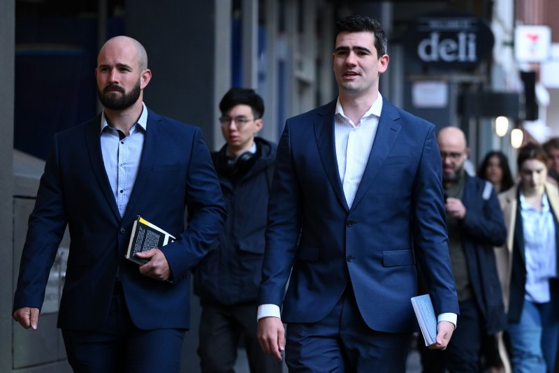 Jacob Hersant (R) arriving at Melbourne Magistrates' Court in Melbourne, Australia, on Friday where he was sentenced to a month in prison for performing an illegal Nazi salute in public a year ago. The maximum prison sentence for the offense is 1 year. Photo by Joel Carrett/EPA-EFE