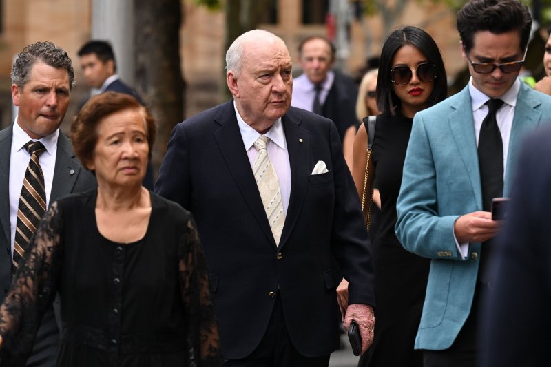 Alan Jones (C), seen here in a February 2023 photo, has been arrested and charged with committing sex offenses against eight people between 2001 and 2019. PHoto by Dean Lewins/EPA-EFE