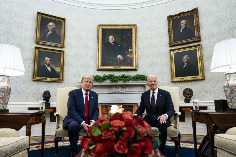 President Joe Biden, right, and President-elect Donald Trump meet in the Oval Office of the White House in Washington, D.C., on Nov. 13 and on Thursday delivered differing holiday messages. Photo by Al Drago/UPI