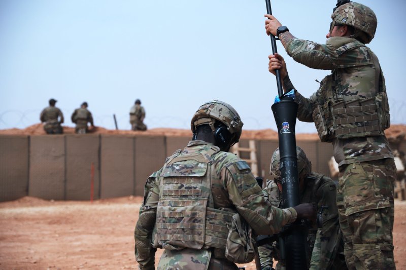 A Soldier deployed to At-Tanf Garrison, Syria, cleans an 81 mm mortar tube during a readiness exercise on April 22, 2020. Central Command Forces on Tuesday attacked Iran-backed militias in Syria. File Photo by Staff Sgt. William Howard/U.S. Army