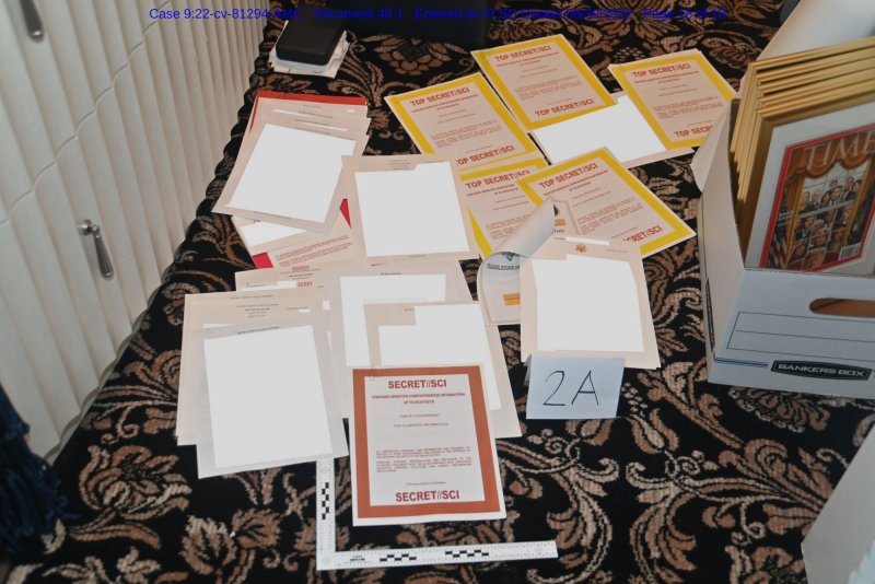 This photo that was included in a court filing submitted by the Department of Justice on August 30, 2022, shows a collection of documents seized by the FBI on August 8th during execution of a search warrant on the Mar-a-Lago resort home of former President Donald Trump. On Tuesday, an appeals court approved a request to drop Trump from the classified documents case. File Photo via Department of Justice/UPI