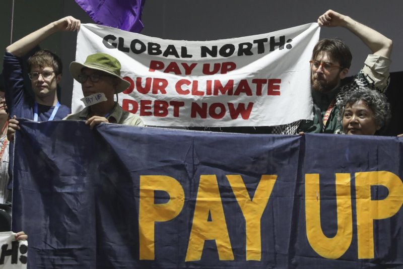 A draft finance deal Friday at the U.N. COP29 climate and environment talks proposes wealthy nations give $250 billion a year to poorer nations in climate funding. Developing countries want more money. Here, climate activists attend a joint protest action Friday at the COP29 climate change conference in Baku, Azerbaijan. Photo by Igor Kovalenko/EPA-EFE