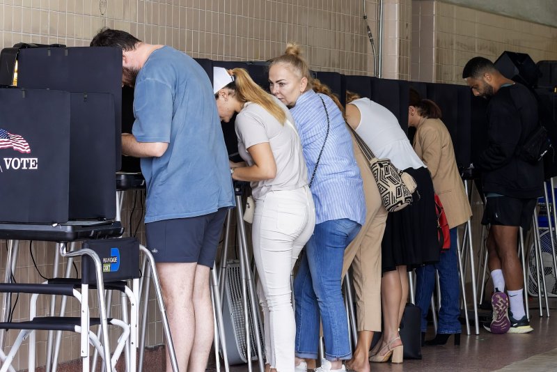 Florida residents are seen filling in their ballots on election day for Democrat and Republican Presidential candidates along with down ballot candidates in Miami on Tuesday. Florida is among nine states with measures related to abortion rights on the ballot. Photo by Gary I Rothstein/UPI