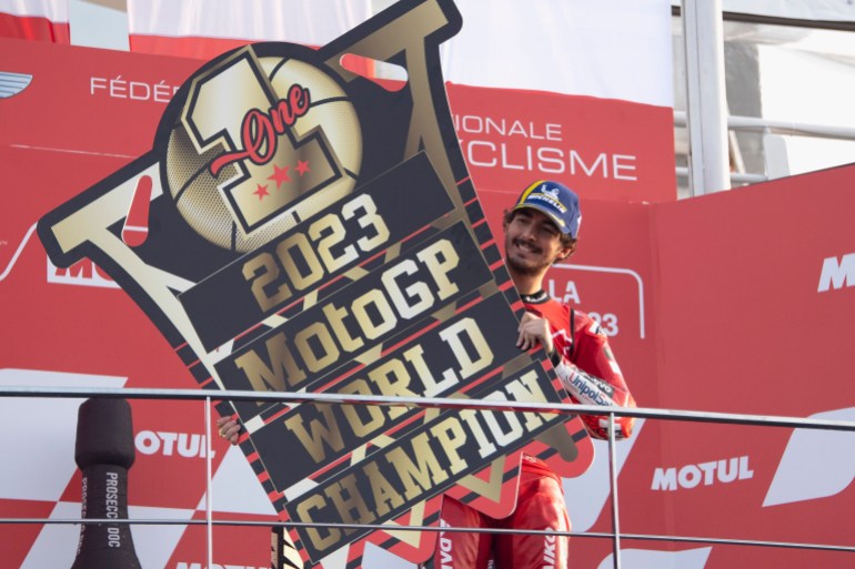 Rider celebrates victory in MotoGP race at Valencia.