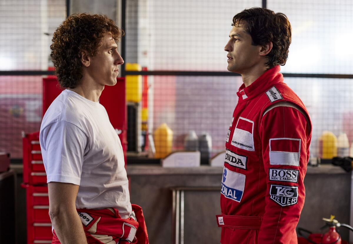 Two racing teammates face off in the garage.