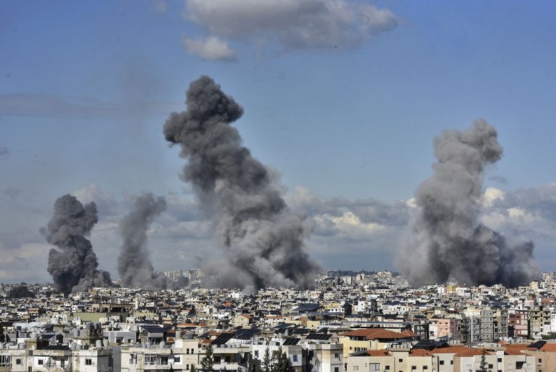 Smoke billows from buildings after the Israeli army launched airstrikes on the Dahieh district in Beirut in Lebanon on Tuesday. Photo by Rahim Rhea/UPI