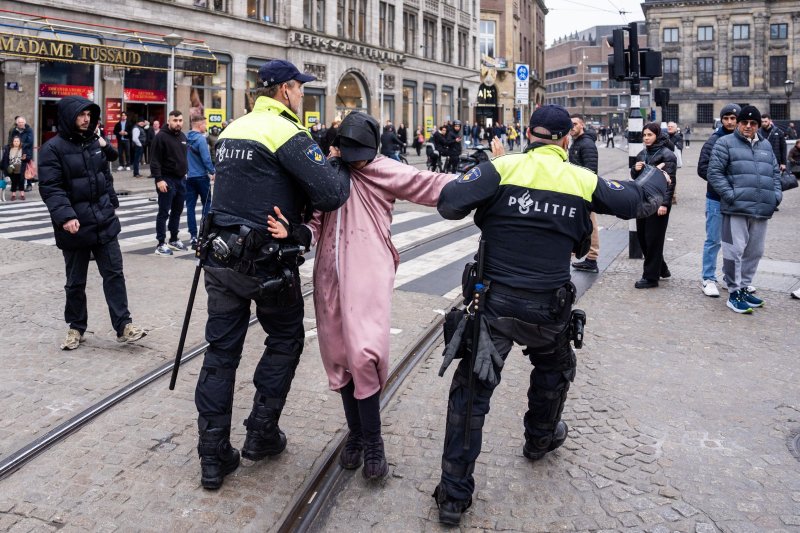 Dutch police detain a man at De Dam in Amsterdam after allegedly provoking Maccabi Tel Aviv supporters ahead of the UEFA Europa League match between Ajax and Maccabi Tel Aviv in Amsterdam, Netherlands, on Nov. 7. Photo by Jeroen Jumelet/EPA-EFE