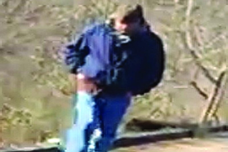 An image taken from a cellphone video shot by 14-year-old Libby German on the day in 2017 that she and 13-year-old Abby Williams were slain near Delphi, Ind., shows a man police believe to be their killer. Prosecutors at the ongoing the double-murder trial of Richard Allen argued he is the "bridge guy" in the image. Photo courtesy Indiana State Police