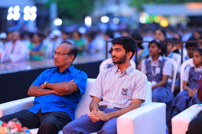 Gukesh (right) in his school uniform at the felicitation ceremony at Vellamal Nexus, where he received a Mercedes car 