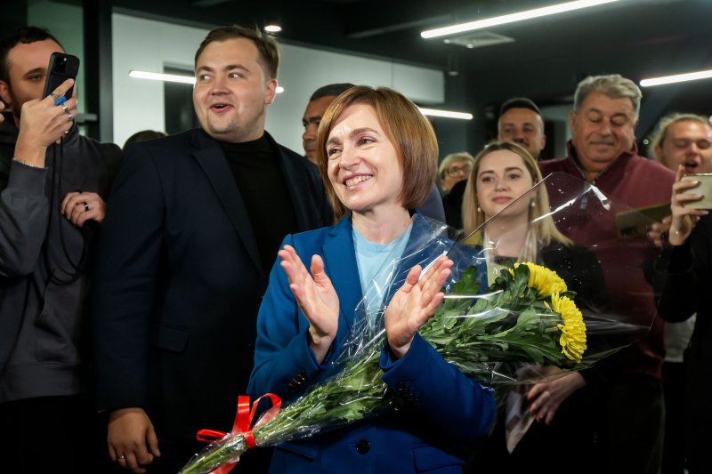 Incumbent President of Moldova Maia Sandu flanked by her supporters following the announcement of the preliminary election results at her campaign headquarters in Chisinau, Moldova, on November 3, 2024. Photo by Dumitru Doru/EPA-EFE