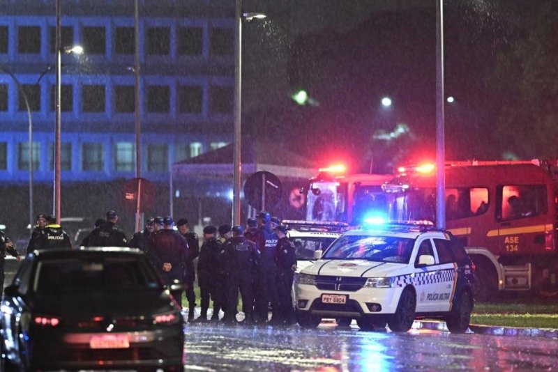 Members of the Military Police of the Federal District, Civil Police, and Judicial Police, guard the site where explosions occurred Wednesday at the Three Powers Plaza in Brasilia, Brazil. According to sources from the police, the explosions of two devices in Brasilia -- detonated in front of the Supreme Court and near the Chamber of Deputies -- were a suicide attack. Photo by Andre Borges/EPA-EFE