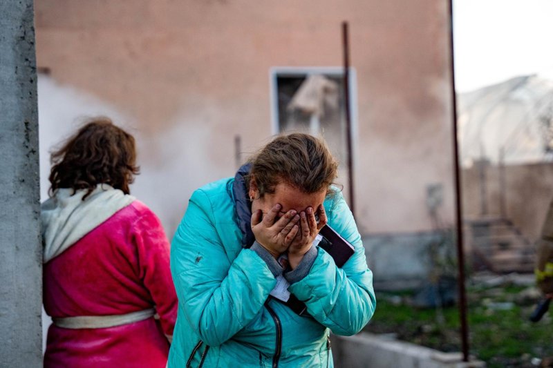 A handout photo released by the press service of the State Emergency Service of Ukraine shows a Ukrainian woman reacting near the site of an air strike in Odesa on Sunday. Photo courtesy of Ukraine's State Emergency Service/Facebook