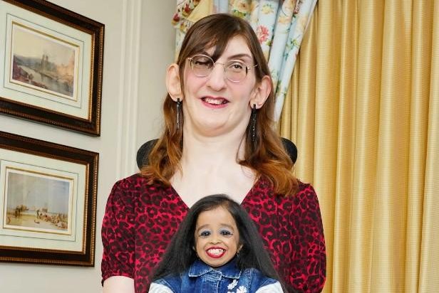 Rumeysa Gelgi holds Jyoti Amge as the world's tallest and shortest women meet at the Savoy Hotel in London on Wednesday. Photo by Guinness World Records