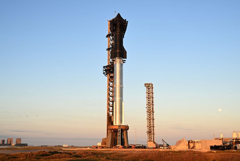 The SpaceX Starship Rocket stands at dawn at Starbase in Boca Chica, Texas, on Saturday. SpaceX plans to launch Starship on its 6th test flight Tuesday following last month's historic booster grab. Photo by Joe Marino/UPI