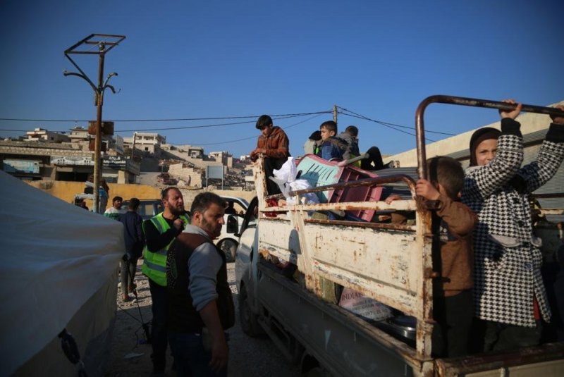 Internally displaced people arrive at a shelter in the town of Al-Bardaqli near the city of Sarmada, Syria, amid ongoing armed conflicts between the Syrian army and opposition forces near Aleppo city on Thursday. Photo by Bilal al Mahmoud/EPA-EFE