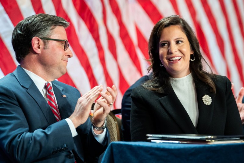 Representative Elise Stefanik, R-N.Y., interacts with House Speaker Mike Johnson, R-La., during a meeting with House Republicans at the Hyatt Regency in Washington, D.C., on Nov. 13 and is among several Cabinet picks and others targeted by swatting calls and bomb threats Tuesday night and Wednesday morning. Pool Photo by Allison Robbert/UPI