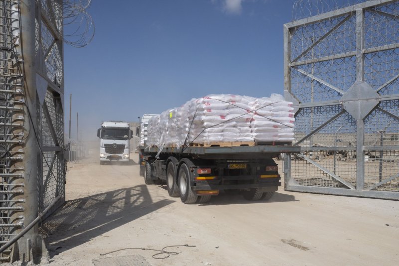 A truck carrying humanitarian aid passed into the Northern Gaza Strip as another drives back into Israel at the Erez Crossing checkpoint after delivering supplies on May 5, 2024. The United States said Tuesday that Israel had largely satisfied its demand for "concrete measures" to address the humanitarian crisis in Gaza within 30 days or risk military assistance being suspended. File Photo by Jim Hollander/UPI