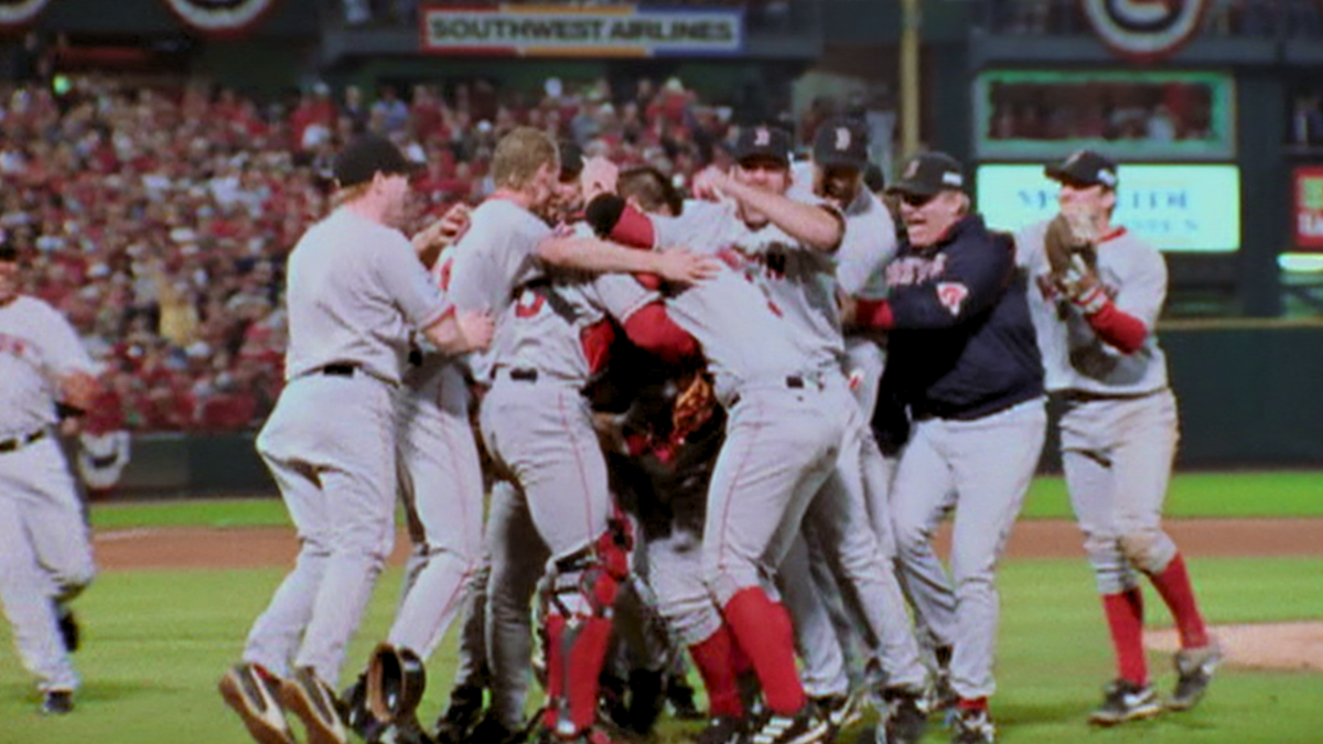 A baseball team celebrates victory on the field.