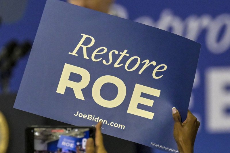 President Biden supporters wave a sign supporting abortion rights at Hillsborough Community College in Tampa, Florida during a rally on April 23, 2024. A Wyoming judge struck down that state's abortion restrictions on Monday. File Photo by Steve Nesius/UPI