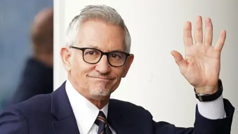 PA Media Gary Lineker in a suit waving