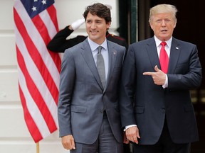 Canadian Prime Minister Justin Trudeau, left, and U.S. President Donald Trump pose for photographs at the White House in October, 2017 in Washington, DC.