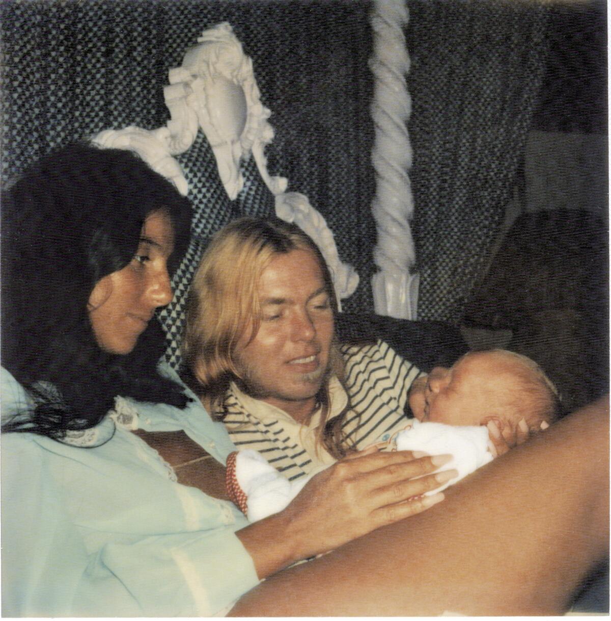 Cher with Greg Allman and their day-old son Elijah.