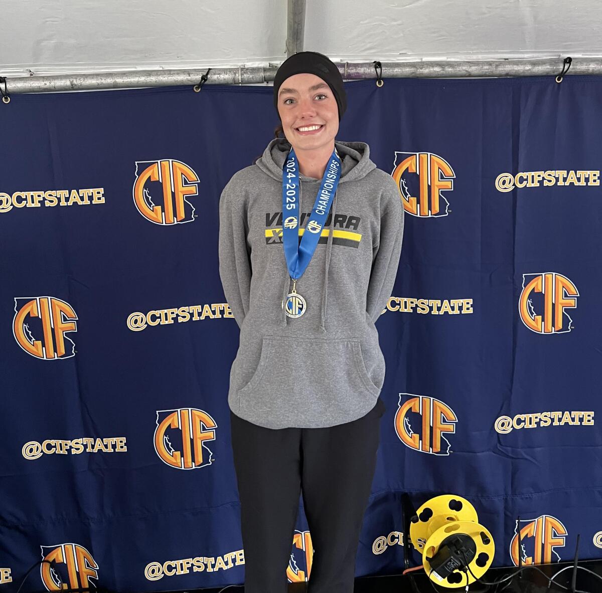 A smiling Sadie Engelhardt of Ventura after winning the Division 2 state cross-country title.