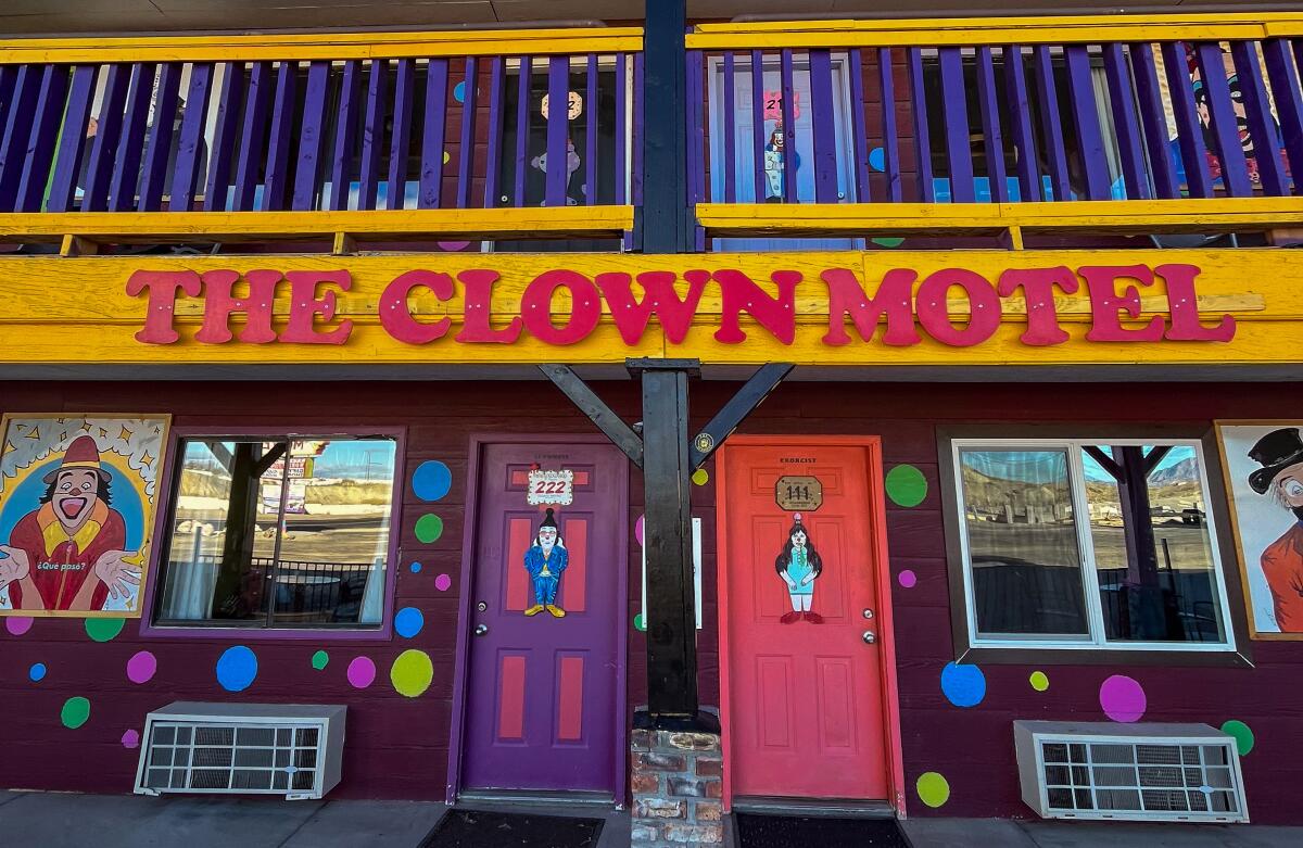 The front of a building reads the Clown Motel.