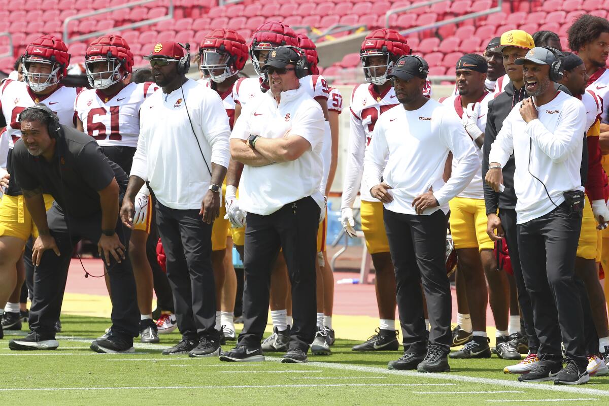 USC defensive coaches look on from the sideline 