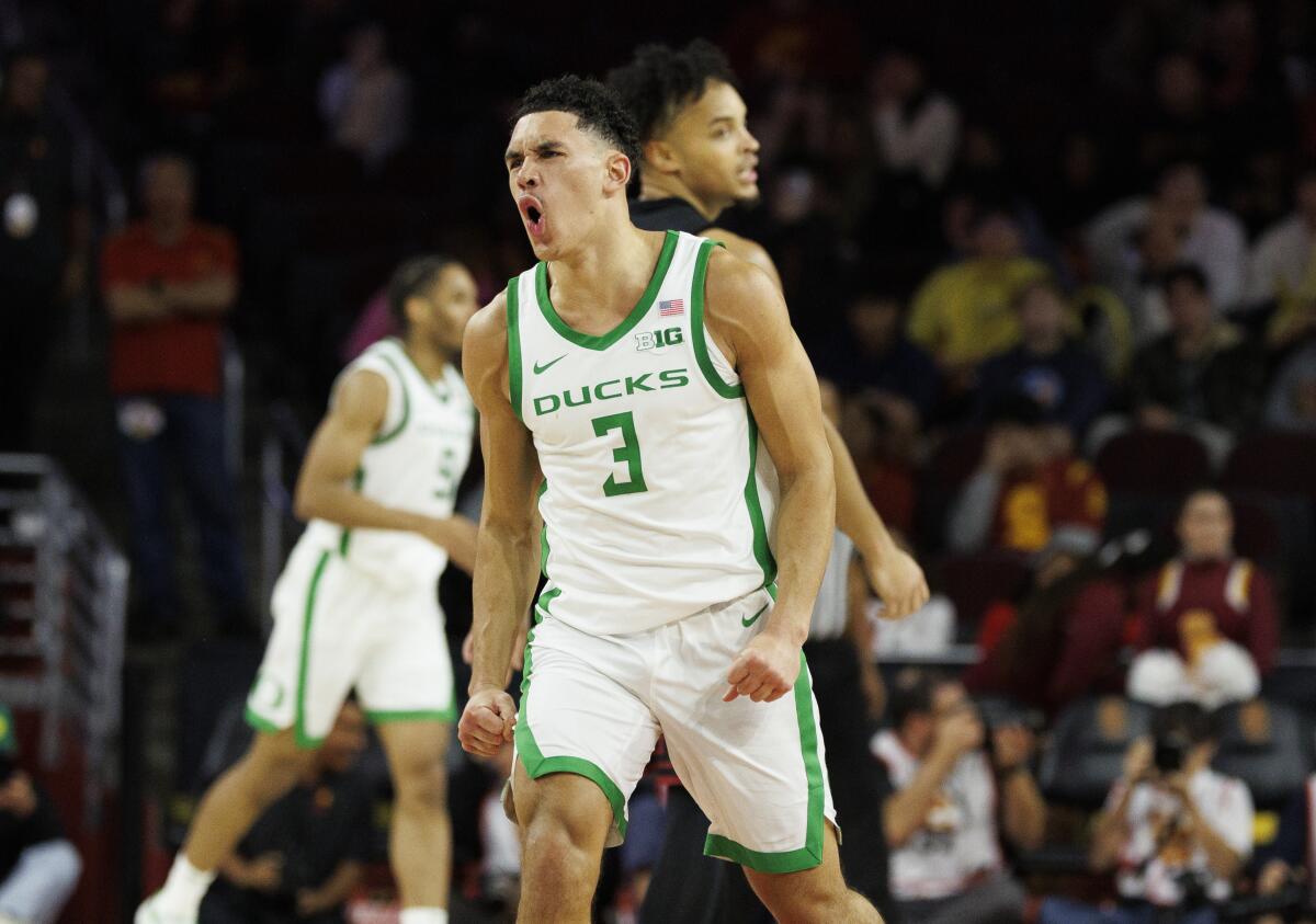 Oregon guard Jackson Shelstad celebrates after making a three-pointer against USC with 4:08 left in the game.