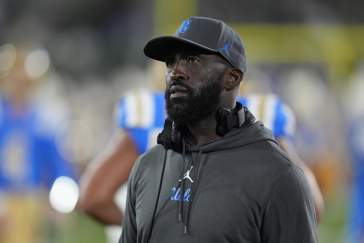 UCLA head coach DeShaun Foster walks on the sideline before an NCAA college football game.