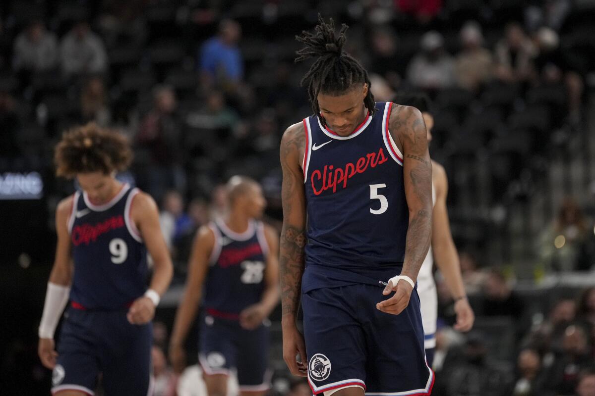 Clippers guards Bones Hyland (5) and Trentyn Flowers (9) walk the court with the heads down at Intuit Dome.