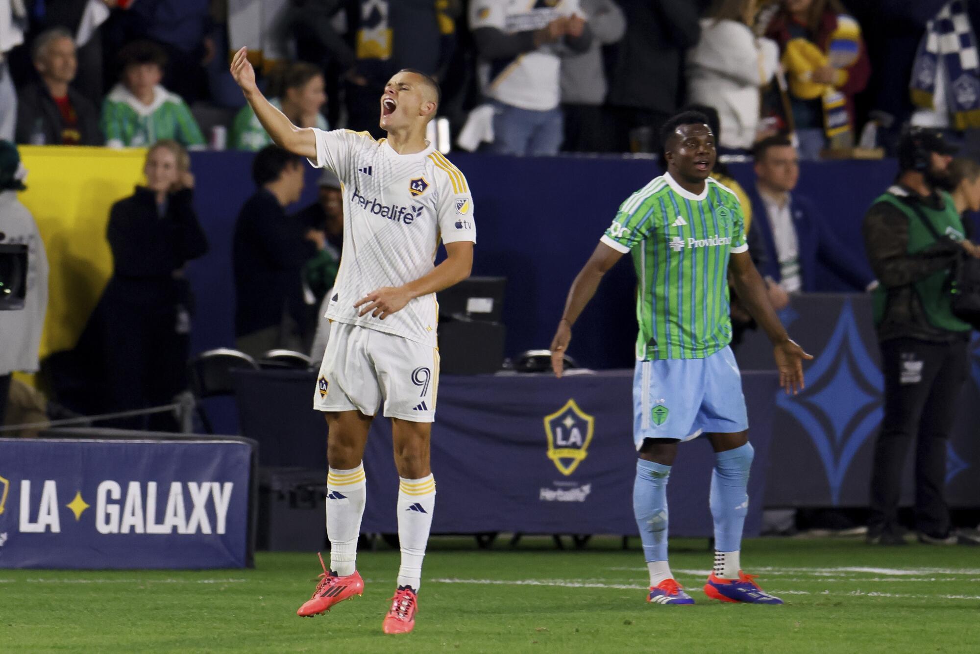 Galaxy forward Dejan Joveljic, left, celebrates after scoring against Seattle.