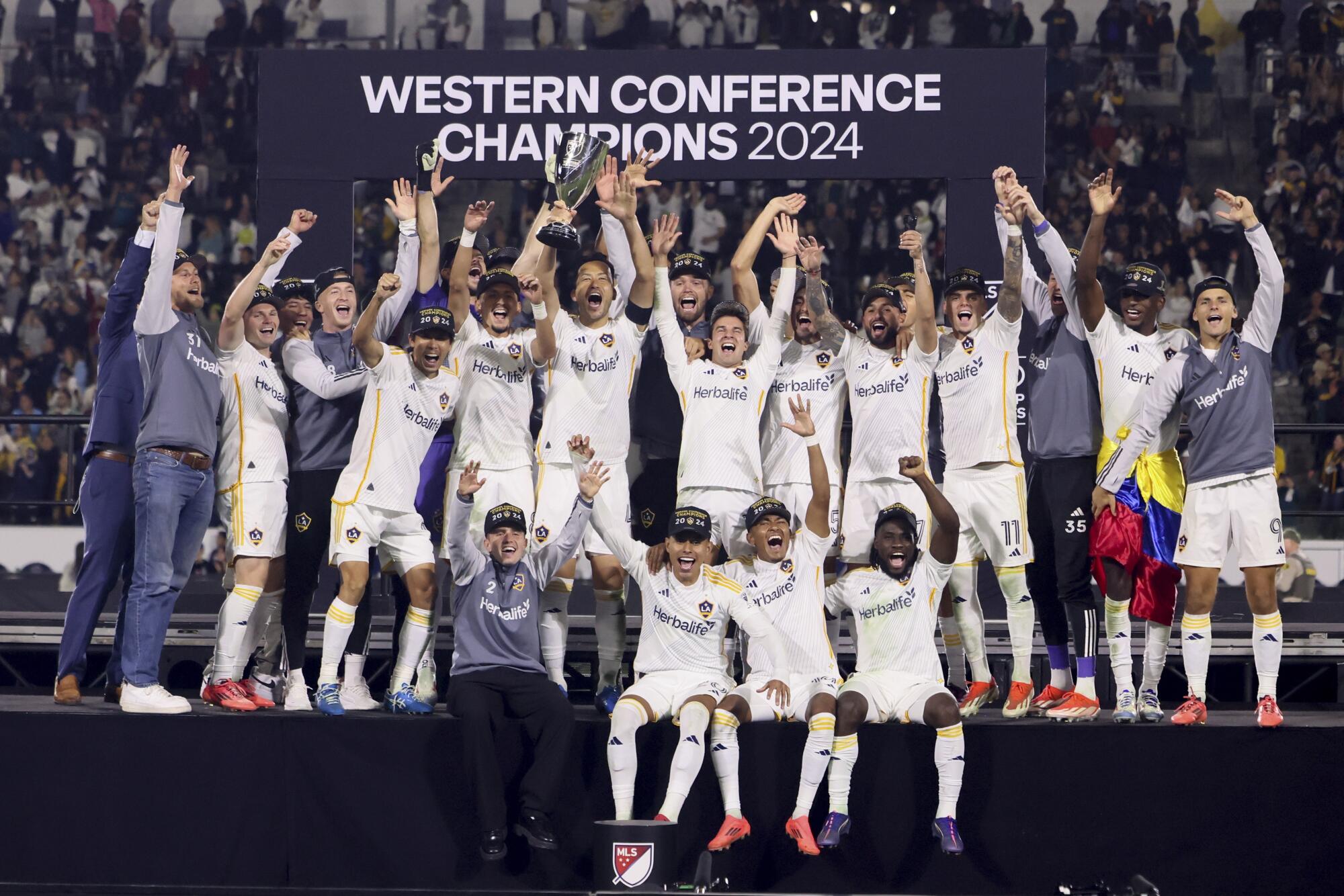 Galaxy players celebrate after defeating Seattle in the Western Conference final at Dignity Health Sports Park on Nov. 30.