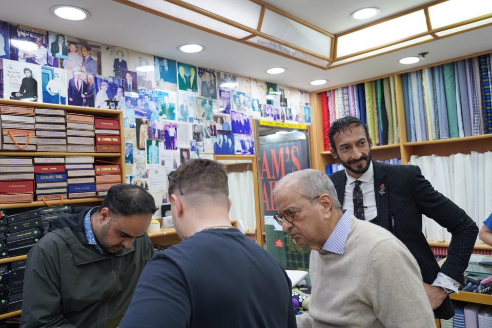 Sun man Jack Keene checks out some of the fabrics in Sam's Tailor