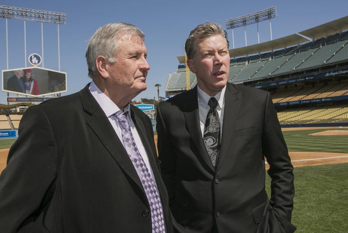 Los Angeles Dodgers former pitchers, Tommy John, left, and Orel Hershiser attend a memorial.