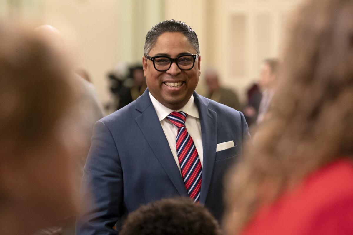 Assemblyman Jeff Gonzalez smiling in a suit