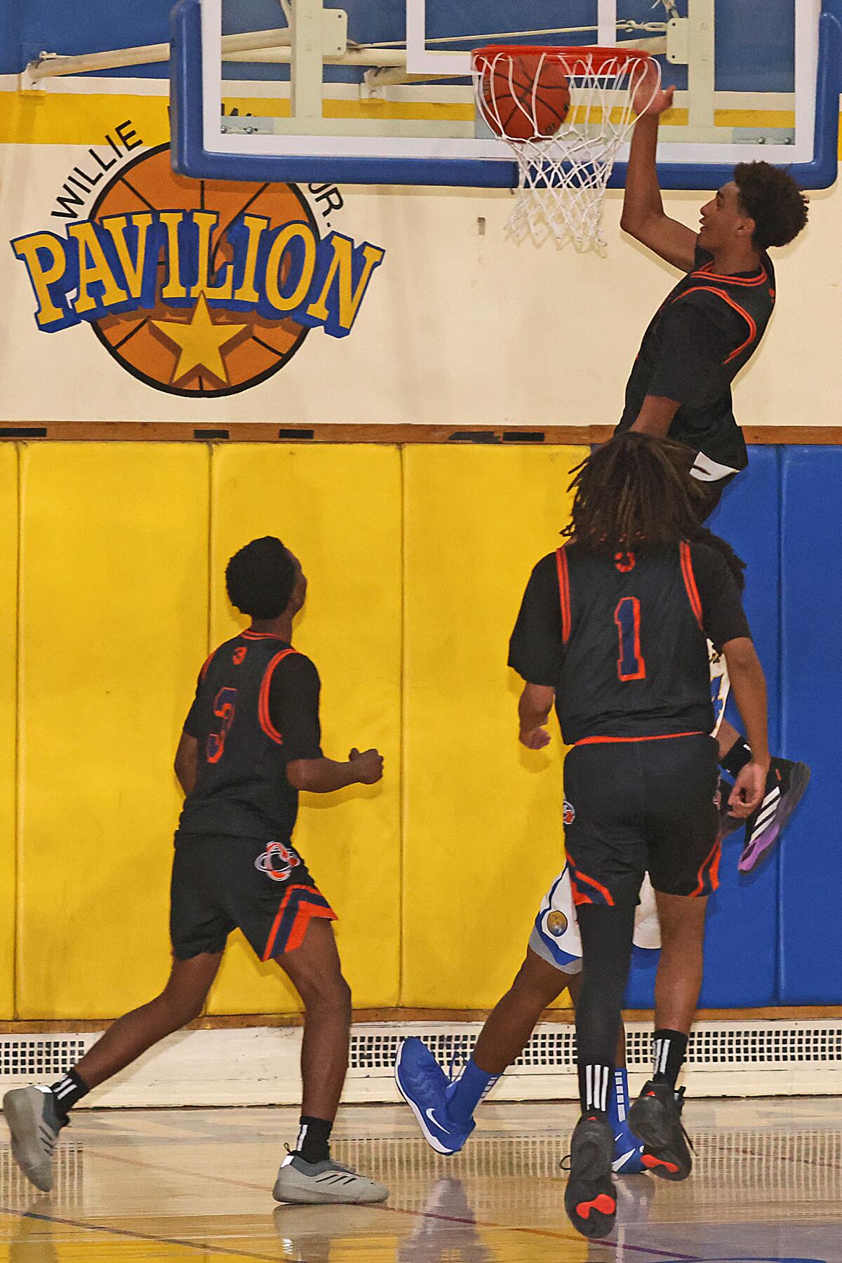 Alijah Arenas of Chatsworth gets an offensive rebound basket against Crenshaw.