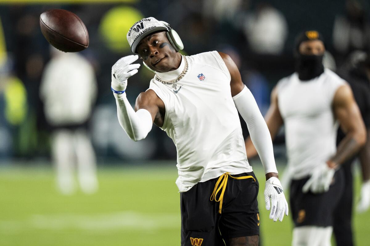 Commanders cornerback Emmanuel Forbes Jr.  warms up before a game against the Eagles. 