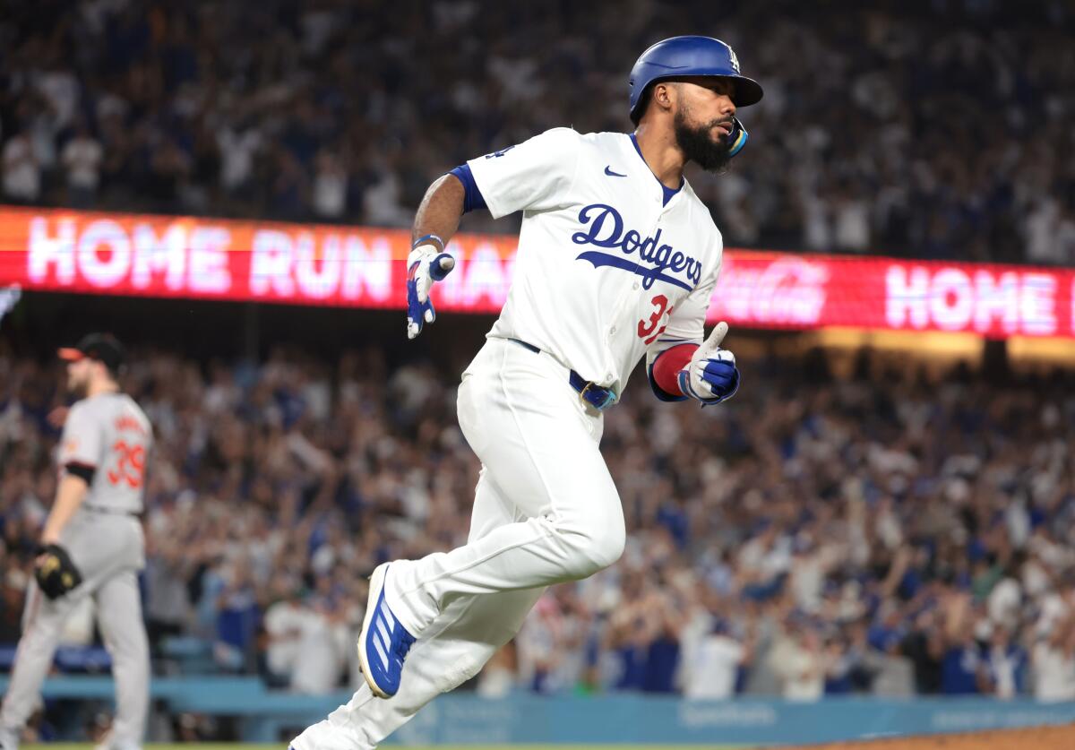 Dodgers outfielder Teoscar Hernández runs the bases after hitting a three-run home run against the Baltimore Orioles.