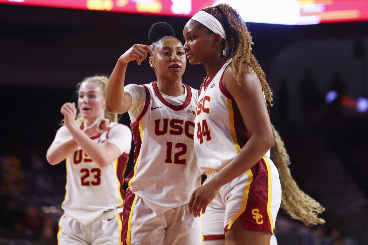 USC guard JuJu Watkins points toward forward Kiki Iriafen during the Trojans' win over Fresno State Tuesday