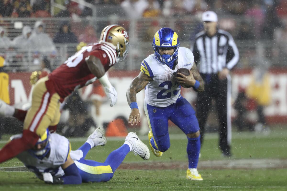 The Rams' Kyren Williams (23) finds running room against the 49ers.