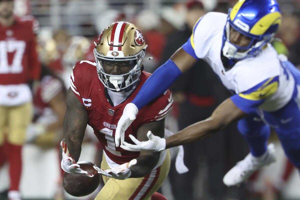 Rams safety Kamren Kinchens knocks away a pass intended for 49ers receiver Deebo Samuel.