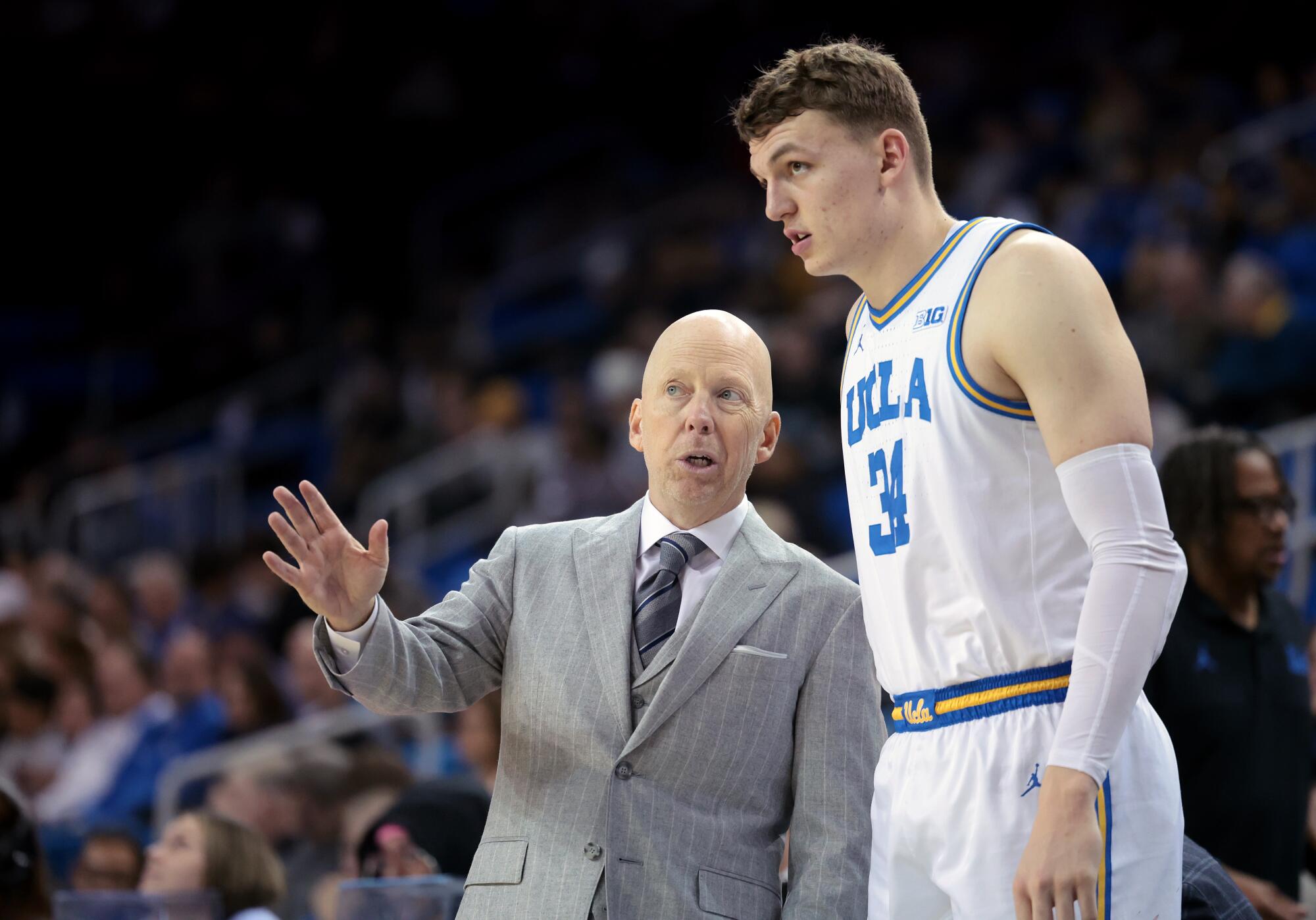 UCLA coach Mick Cronin talks with Tyler Bilodeau during a game against Lehigh at Pauley Pavilion on Nov. 15.