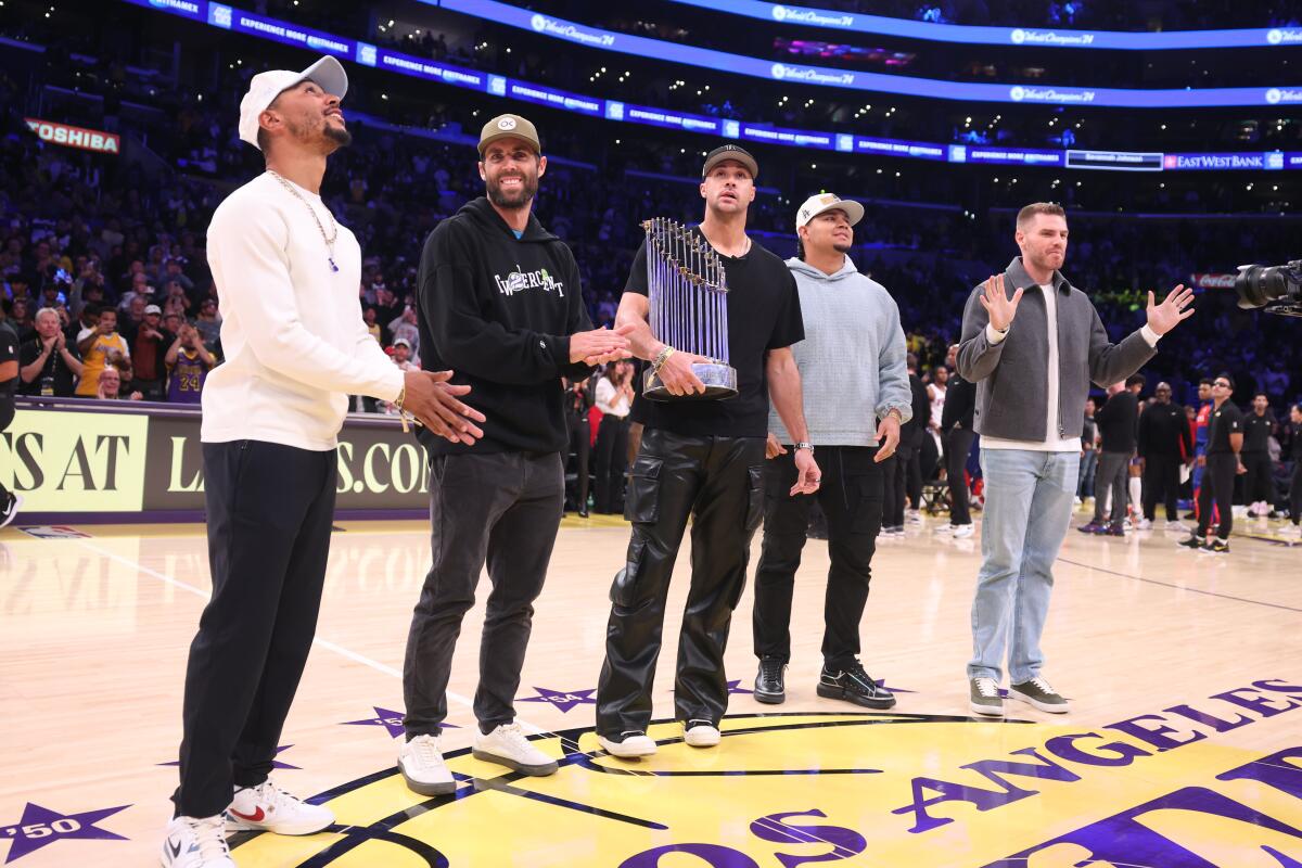 Dodgers players, from left, Mookie Betts, Chris Taylor, Jack Flaherty, Brusdar Graterol and Freddie Freeman are honored.