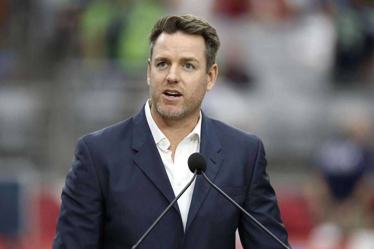 Carson Palmer speaks after being added to the Arizona Cardinals ring of honor during a game in September 2019.